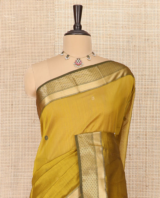 Mustard Silk Cotton Saree Enriched with Floral Buttas All Over the Body, Complemented by a Contrast Traditional Zari Design Border, Featuring a Pallu of Meena Floral Buttas, and Paired with a Contrast Blouse