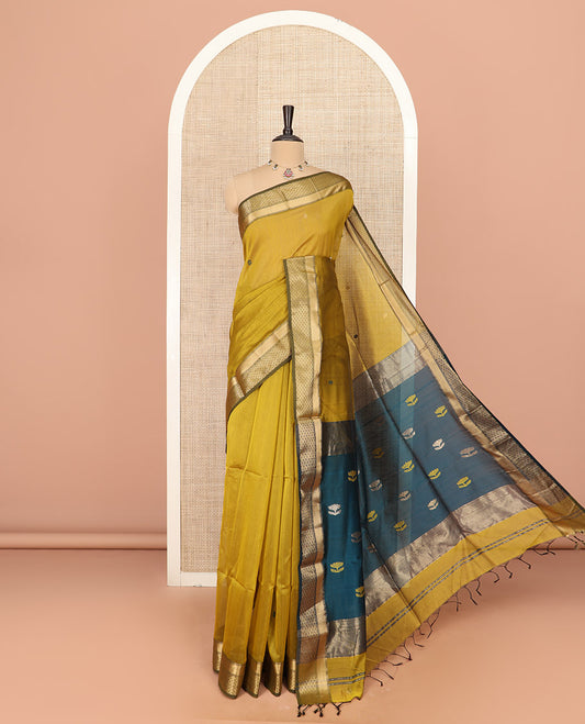 Mustard Silk Cotton Saree Enriched with Floral Buttas All Over the Body, Complemented by a Contrast Traditional Zari Design Border, Featuring a Pallu of Meena Floral Buttas, and Paired with a Contrast Blouse