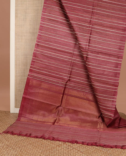 Brown vertically striped tussar silk saree, striped border and temple pallu