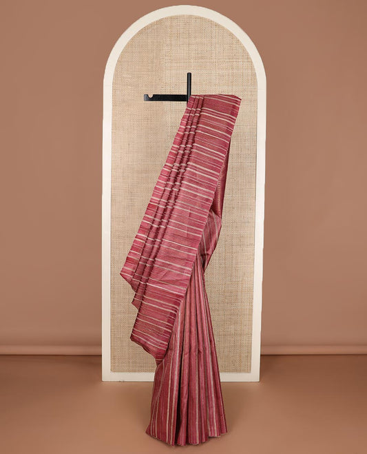 Brown vertically striped tussar silk saree, striped border and temple pallu