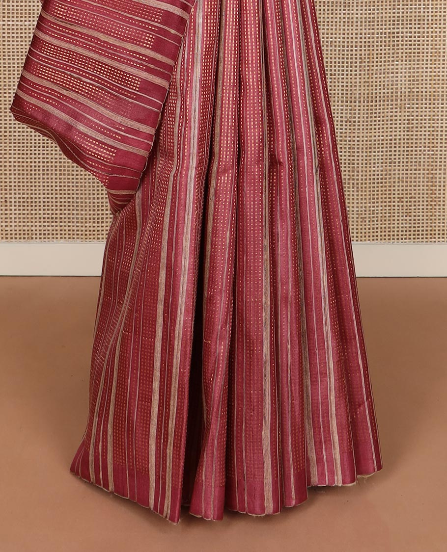 Brown vertically striped tussar silk saree, striped border and temple pallu