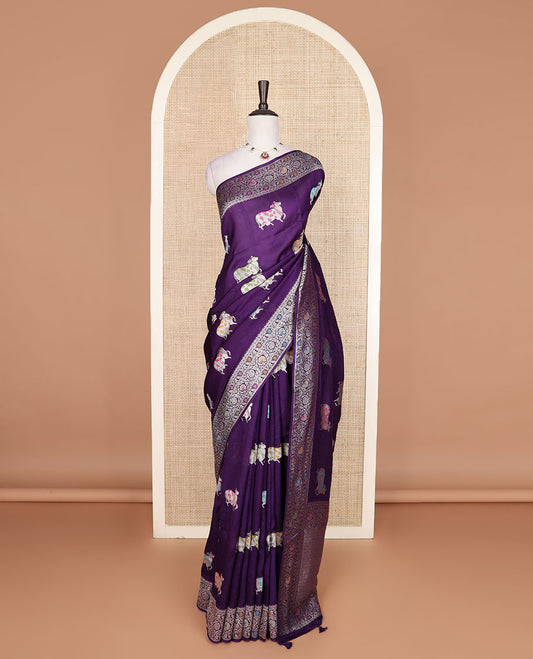 Purple Matka silk saree features Pichwai cow motifs, floral creeper design border, and intricate pallu