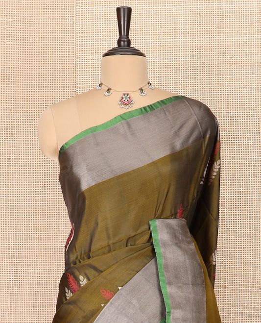 Green Semi Uppada Saree Highlighted with Leaf Buttas, Complemented by a Contrasting Border, Pallu Featuring Intricate Zari Designs, and Paired with a Contrast Blouse