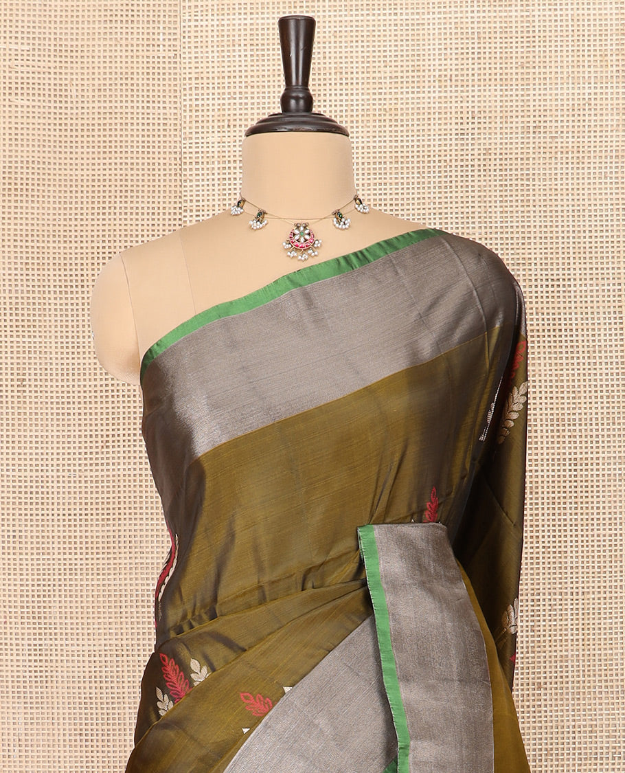 Green Semi Uppada Saree Highlighted with Leaf Buttas, Complemented by a Contrasting Border, Pallu Featuring Intricate Zari Designs, and Paired with a Contrast Blouse