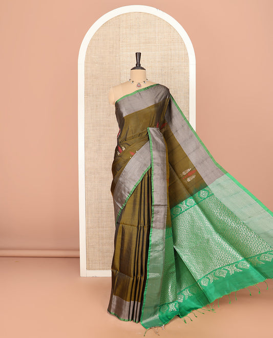 Green Semi Uppada Saree Highlighted with Leaf Buttas, Complemented by a Contrasting Border, Pallu Featuring Intricate Zari Designs, and Paired with a Contrast Blouse