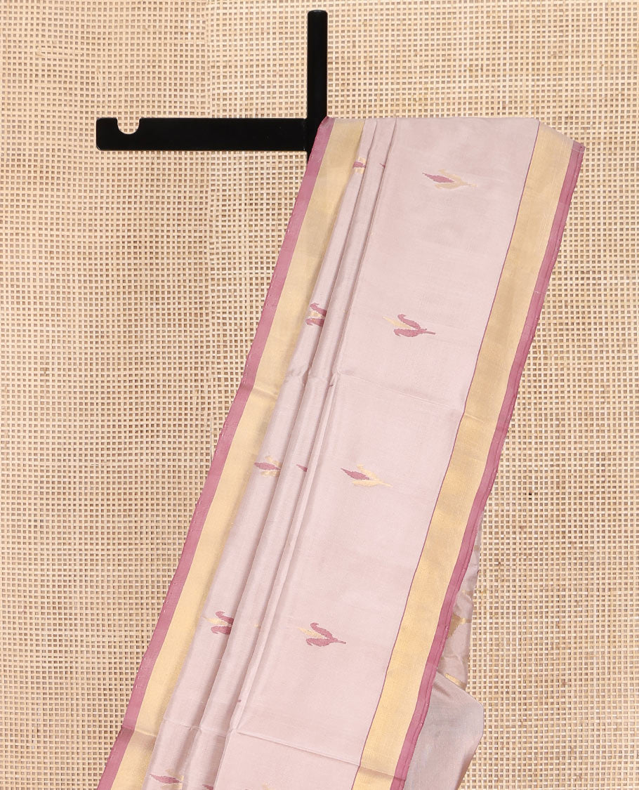 Light Sandal Uppada Silk Saree, Sparsely Woven with Floral Buttas on Its Body, Highlighted by a Contrast Zari Bavanji Border, Pallu of Floral Designs, and Paired with a Matching Blouse