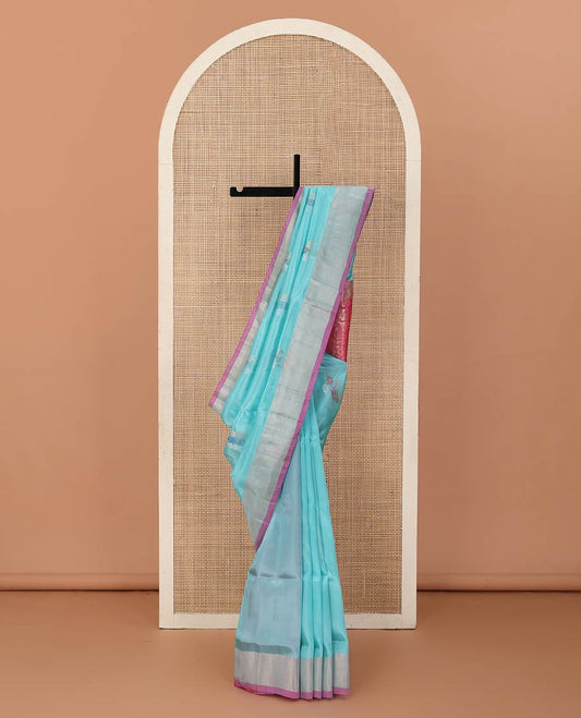 Blue zari buttas Uppada saree, contrast bavanji border, and leaf design pallu