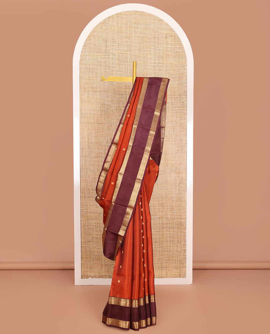 Orange Vasundhara Lite-Silk Mix Saree, Prettified with Zari Buttas, Complemented by Contrast Rettai Pettu Border Featuring Thilakam, Ara Bogudi, Neli, and Kamalam Designs, Grandly Woven Pallu of Floral Designs, and Paired with a Contrast Blouse