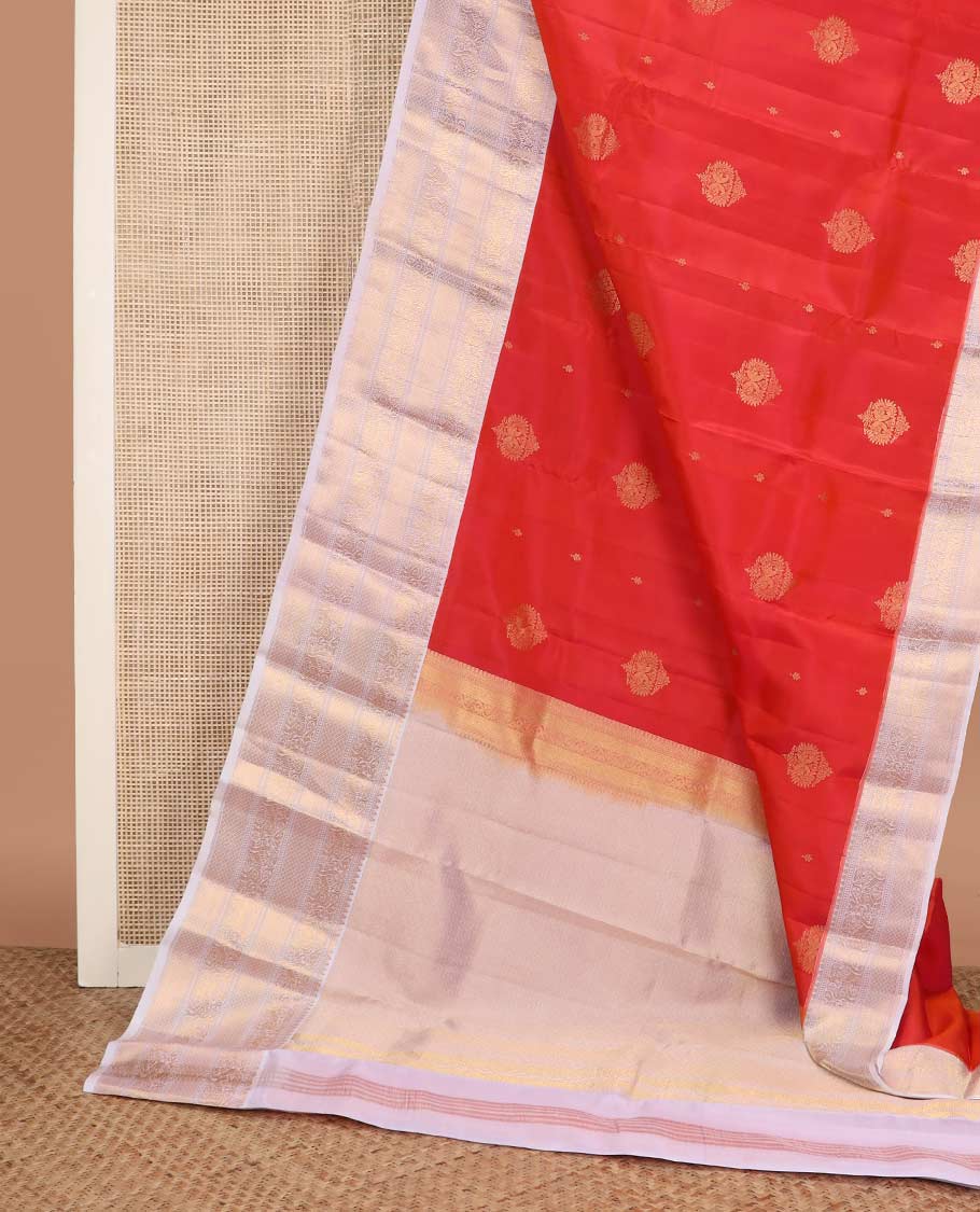 Orange zari buttas Vasundhara silk mix saree, contrast border of rekku, muthu, yaali, and mayil kann designs, and jaal pallu