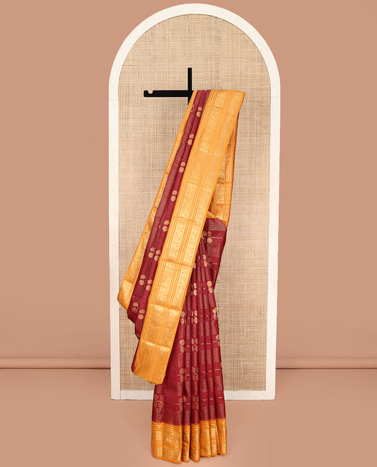 Orange Vasundhara Lite Silk Mix Saree, Majestically Detailed with Zari Butta Enclosed Checked Design on Its Body, Complemented by a Contrast Border of Neli, Kathir, Mayil, and Chakram Designs, Intricately Designed Pallu, and Paired with a Contrast Blouse