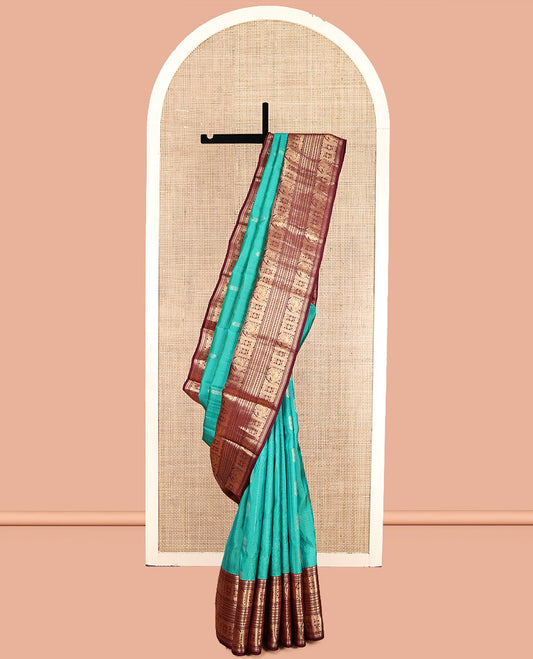 Green Vasundhara Lite Silk Mix Saree, Decked Up with Buttas and Stripes, Complemented by a Contrast Border of Bentex, Mayil Kann, Mayil, and Chakra, Intricate Pallu, and a Contrast Blouse