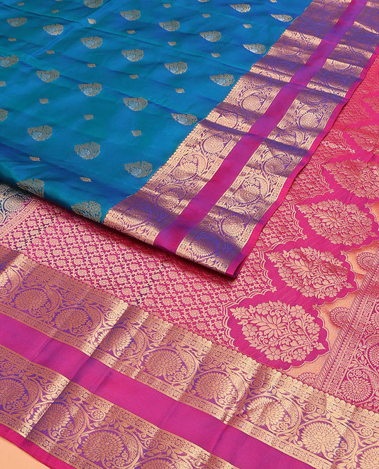 Blue Vasundhara Lite Silk Mix Saree, Prettified with Zari Buttas on Its Body, Complemented by a Contrast Rettai Pettu Border of Thilakam Mokku, and Kodi Visiry Designs, Opulently Embellished Pallu, and Paired with a Contrast Blouse