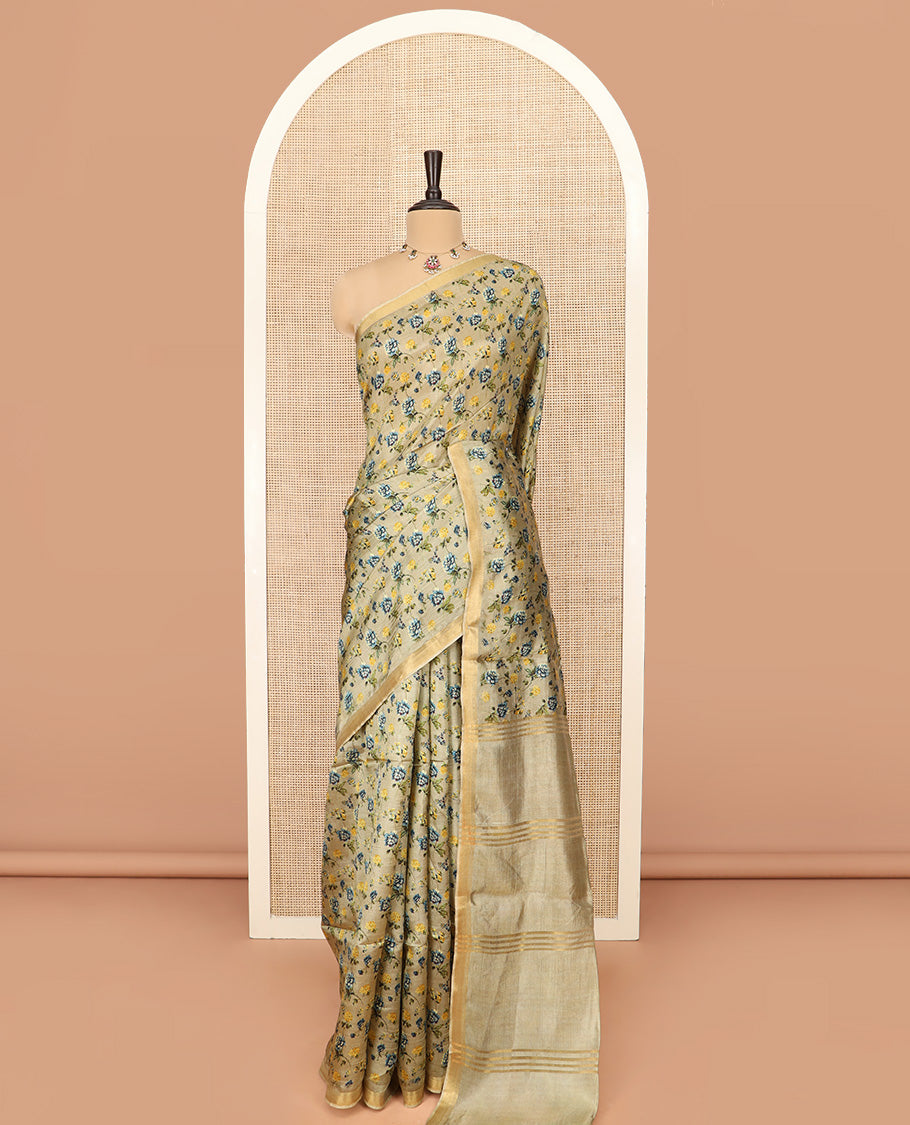 Khaki Banana Pith Saree Prettified with Floral Motifs Digital Print, Subtle Zari Border, Pallu Gleamed Up with Zari Stripes, and Paired with a Contrast Floral Printed Blouse