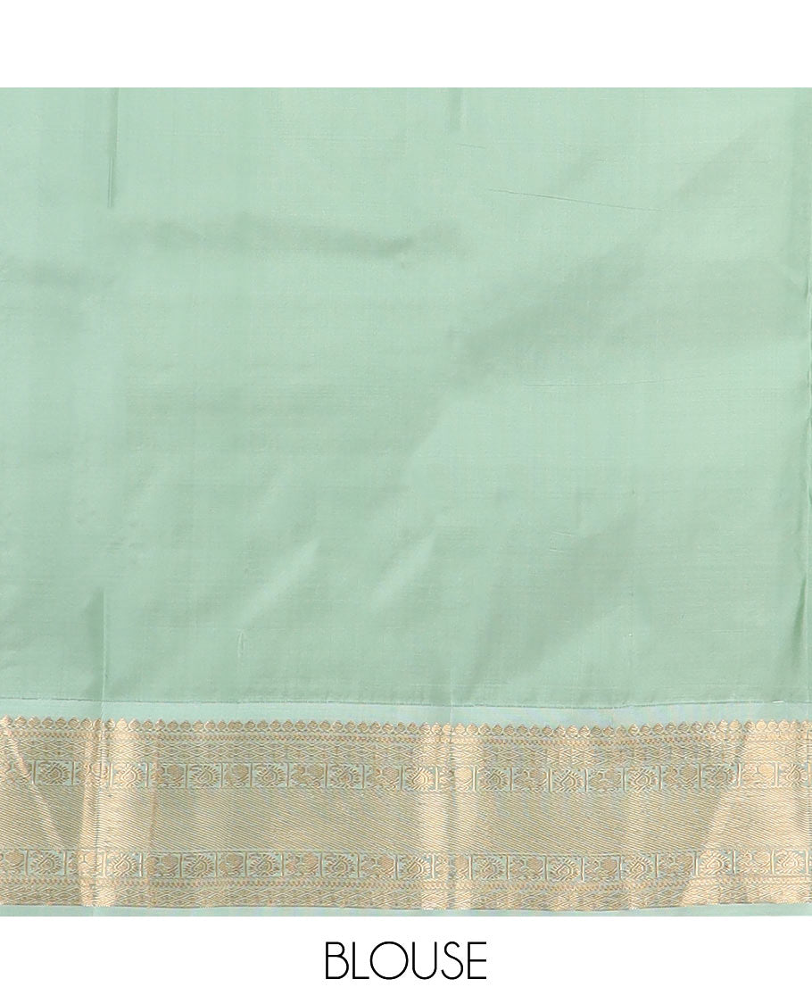 Pink zari buttas silk saree, contrast border of thilakam mokku, jaal, manga, and mayil designs, and Mughal-style intricate pallu