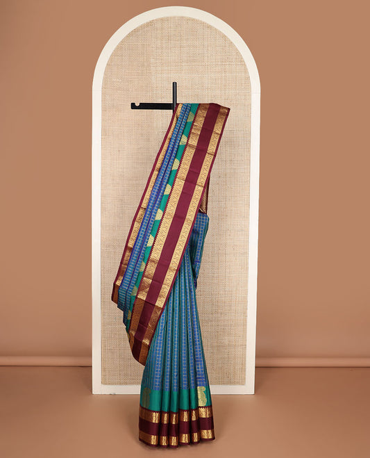 Blue zari checked silk saree, contrast rettai pettu border of manga,rekku & kodi visiry & pallu of seppu rekku & jaal designs