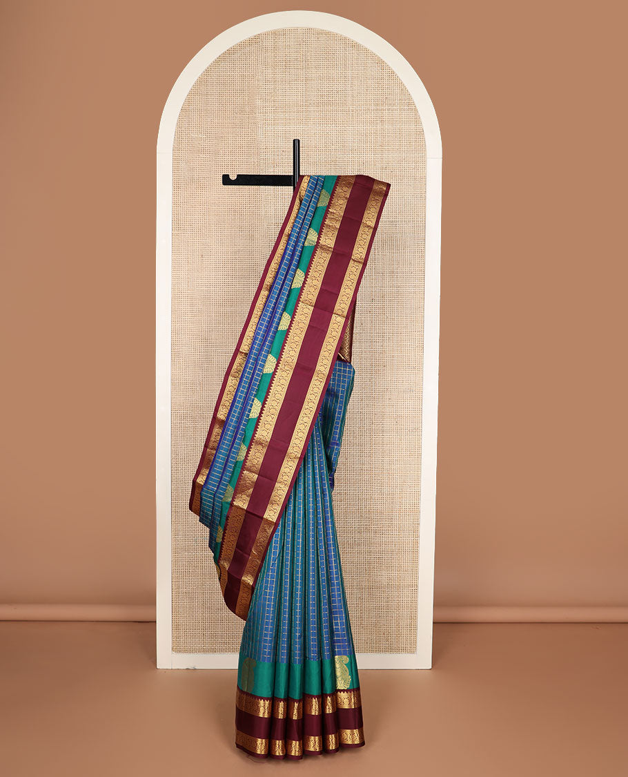 Blue zari checked silk saree, contrast rettai pettu border of manga,rekku & kodi visiry & pallu of seppu rekku & jaal designs