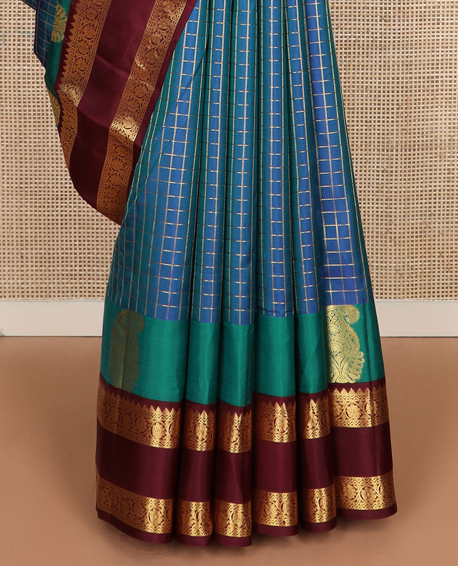 Blue zari checked silk saree, contrast rettai pettu border of manga,rekku & kodi visiry & pallu of seppu rekku & jaal designs
