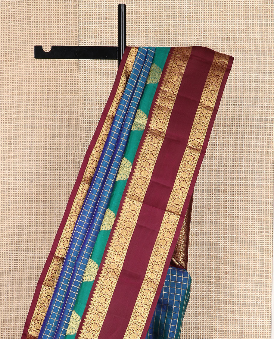 Blue zari checked silk saree, contrast rettai pettu border of manga,rekku & kodi visiry & pallu of seppu rekku & jaal designs