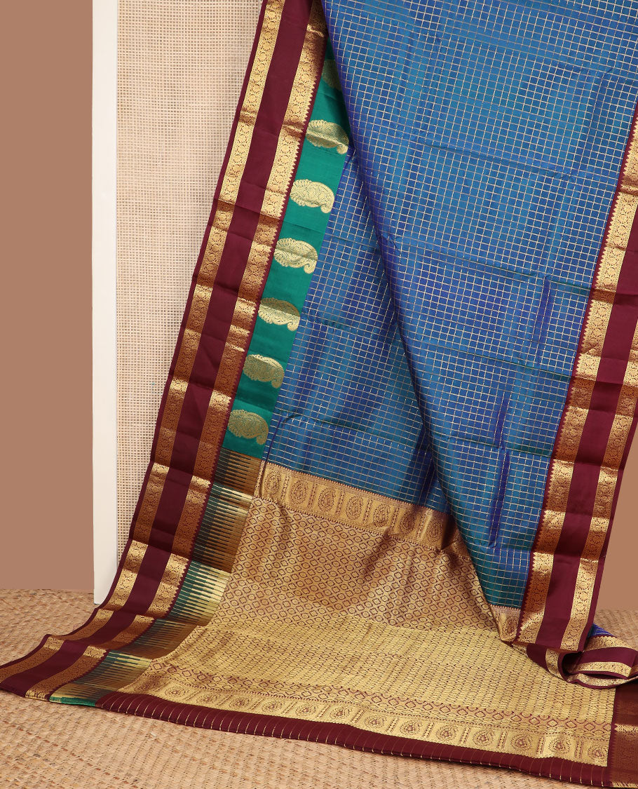 Blue zari checked silk saree, contrast rettai pettu border of manga,rekku & kodi visiry & pallu of seppu rekku & jaal designs
