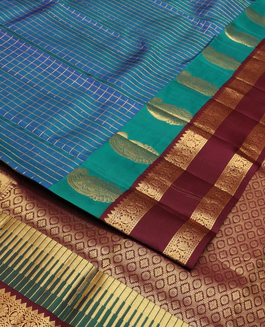 Blue zari checked silk saree, contrast rettai pettu border of manga,rekku & kodi visiry & pallu of seppu rekku & jaal designs