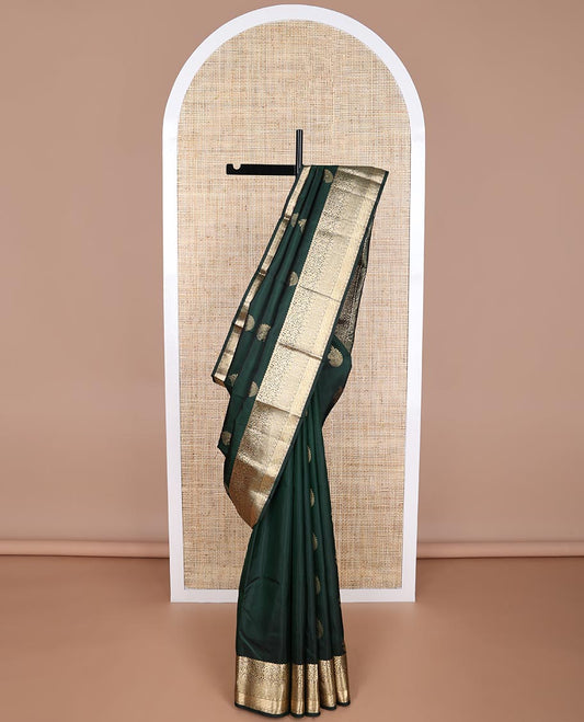 Bottle green leaf buttas silk saree with self floral design border & floral, paisley design pallu