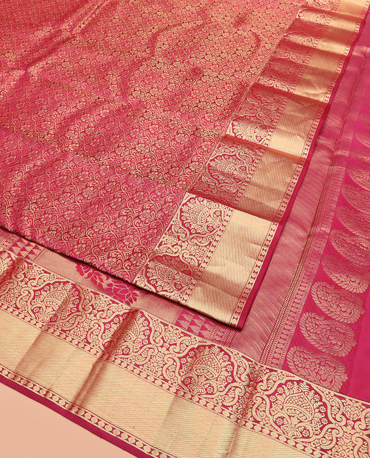 Red  Kanchipuram Wedding Silk Saree Spotlighted with Jacquard Designs, Highlighted with a Zari Border, Artfully Detailed Pallu of Thazampoo Rekku, and Floral Designs, and Paired with a Matching Blouse