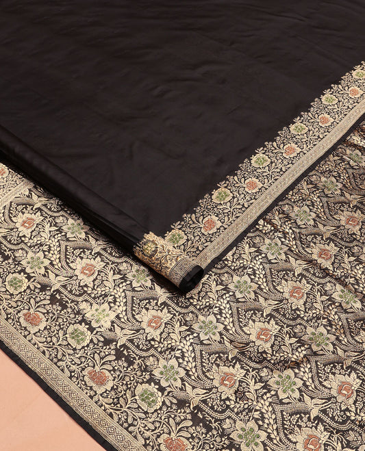 Black plain banarasi kathan silk saree,  floral creeper meenakari border, and Mughal-style arches and floral design weave
