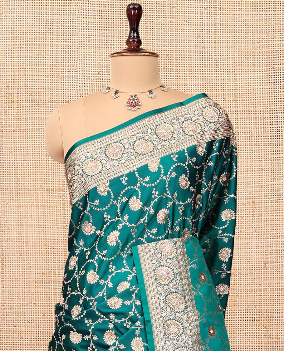 Green Banarasi Satin Saree, Bedecked with Floral Jaal Jacquard, a Floral Creeper Border, Intricate Stonework Pallu, and a Matching Blouse