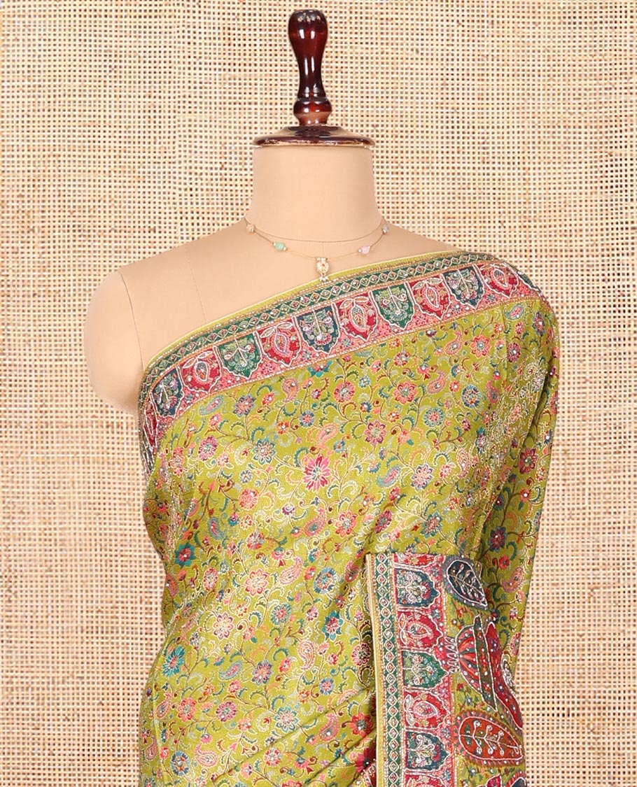 Green Dola Silk Saree, Elevated with Floral and Paisley Design on Its Body, Highlighted by Intricate Mughal Border, Pallu of Floral and Paisley Design, and Paired with a Matching Blouse