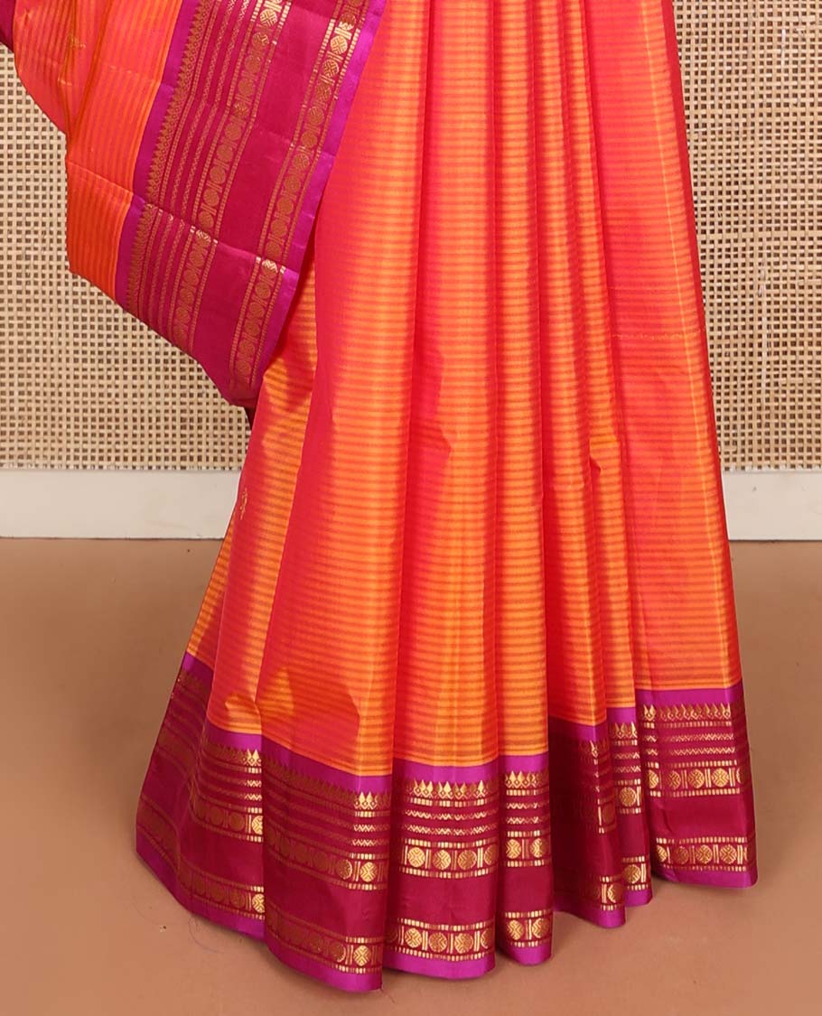 Orange striped and buttas Kanchipuram silk saree, contrast border and pallu of thilakam mokku, muthu, neli, and rudraksham designs