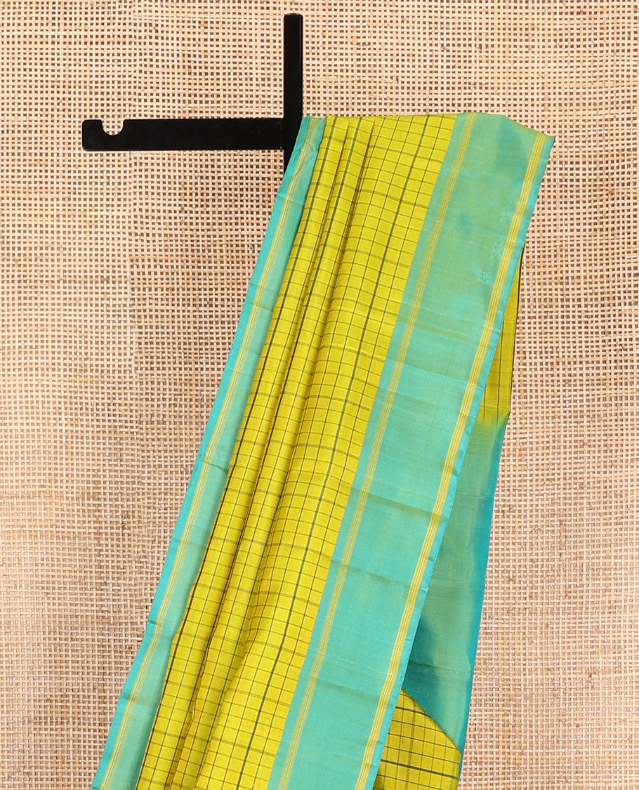 Green checked Kanchipuram silk saree, contrast striped border, and pallu of stripes