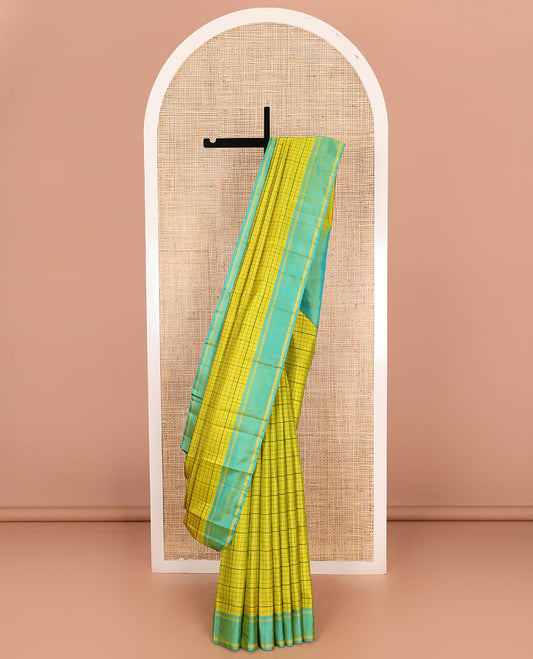 Green checked Kanchipuram silk saree, contrast striped border, and pallu of stripes