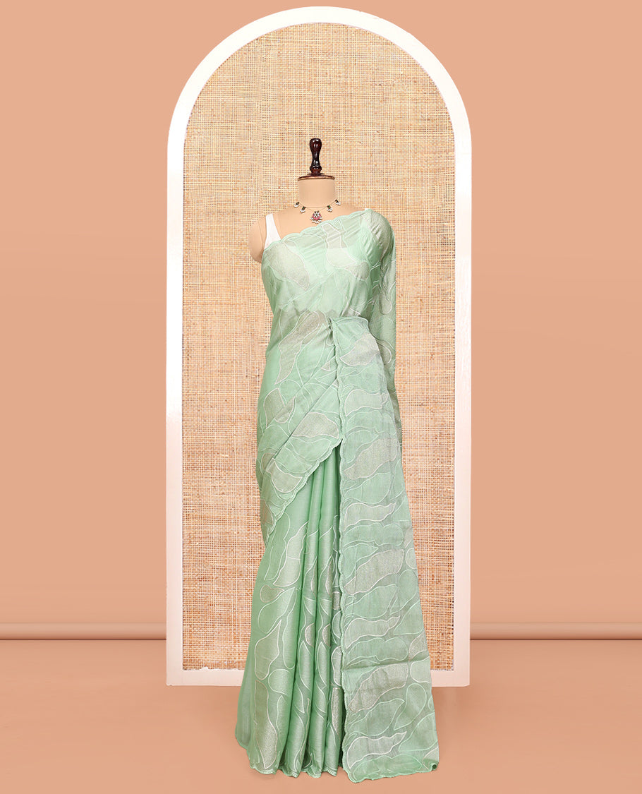 Pista Green Organza Saree, Subtly Enriched with Abstract-Style Embroidery, a Scallop Border, and a Matching Blouse
