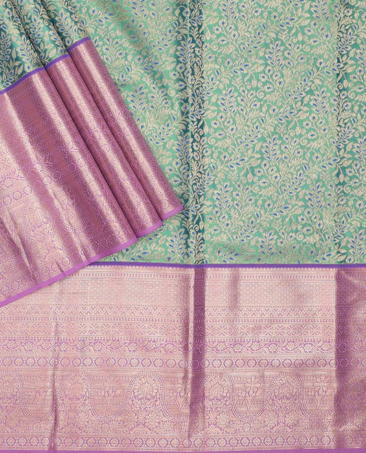 Green pure-silk half saree, jacquard with contrast traditional zari bordered skirt, blouse of thilakam, muthu, mayil kann,  kodi visiry, and kamalam motifs, and zari design dhavani