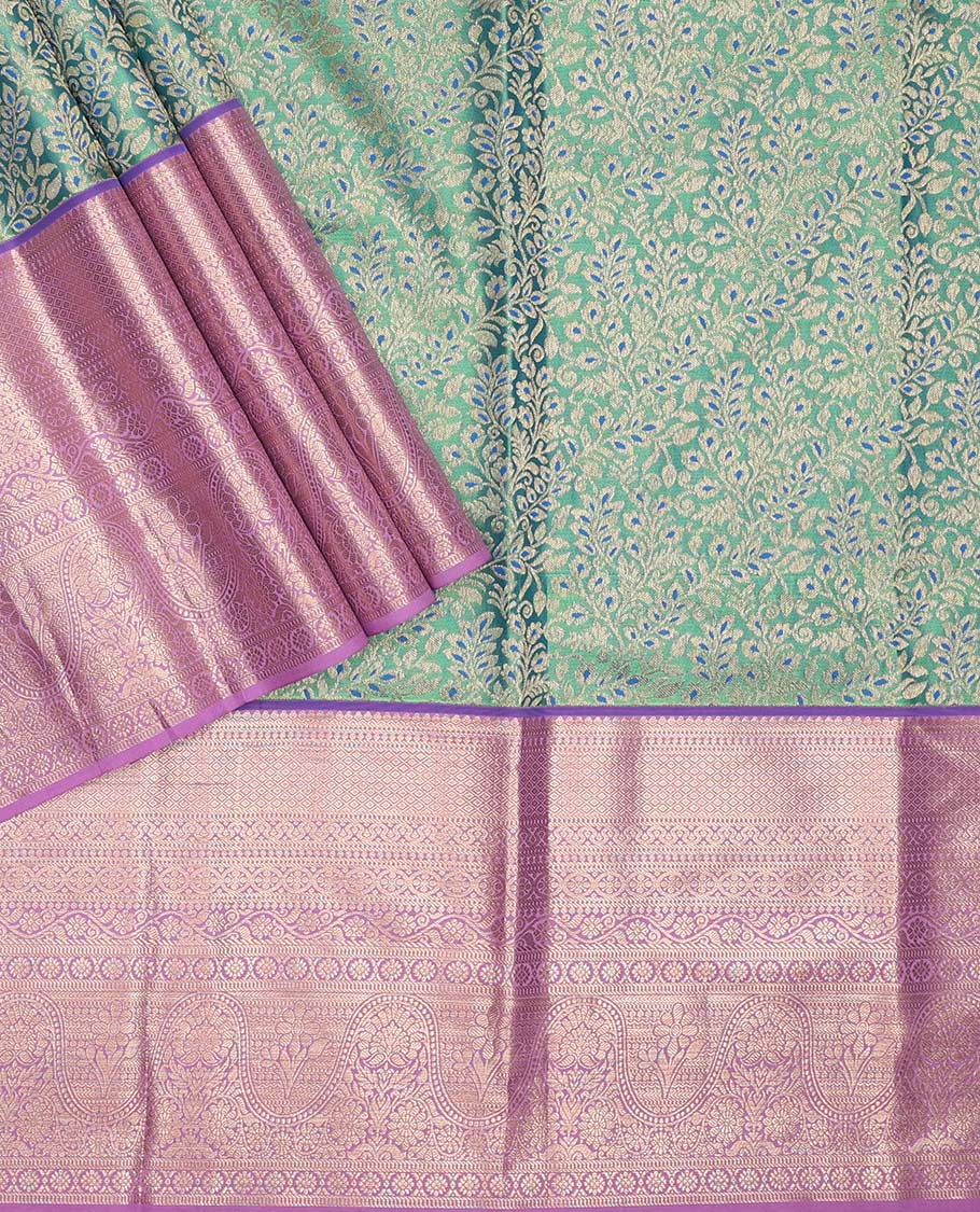 Green pure-silk half saree, jacquard with contrast traditional zari bordered skirt, blouse of thilakam, muthu, mayil kann,  kodi visiry, and kamalam motifs, and zari design dhavani