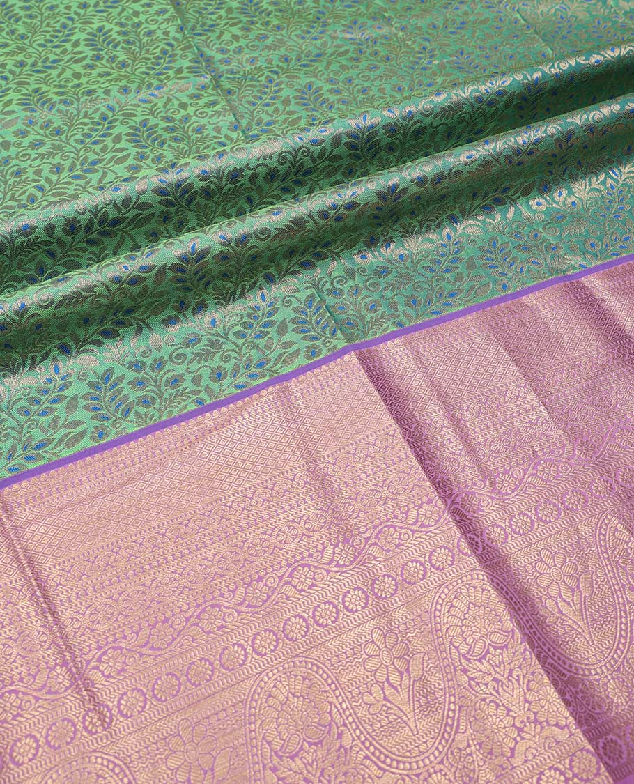 Green pure-silk half saree, jacquard with contrast traditional zari bordered skirt, blouse of thilakam, muthu, mayil kann,  kodi visiry, and kamalam motifs, and zari design dhavani