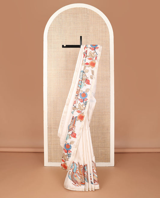 Cream colorful kalamkari-style floral & peacock motif printed tussar saree, zari border & pallu of zari stripes
