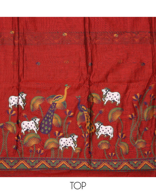 Orange material chudidar set, hand-painting style Pichwai lotus, cow and peacock printed top, plain bottom and dupatta mirrors the same top print