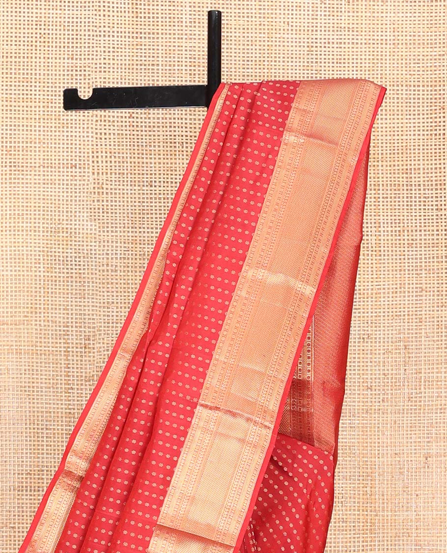 Red Vasundhara Lite Silk Mix Saree, Adorned with Zari Buttas All Over Its Body, Highlighted by Zari Border of Rudraksham, Banaras, Manga, and Mayil Kann Designs, Diagonally Striped Pallu, and Paired with a Matching Blouse