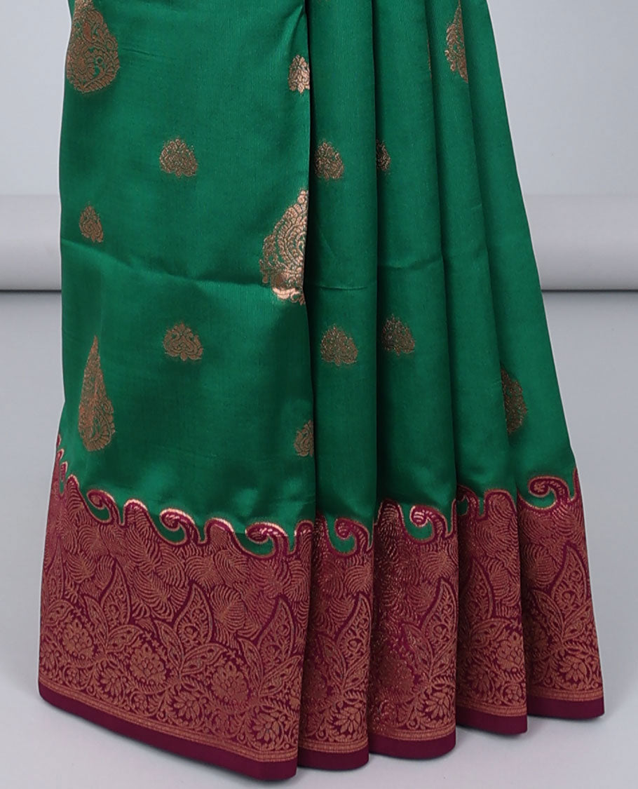 Green butter silk saree with zari buttas, contrast zari border of floral designs & pallu of intricate designs