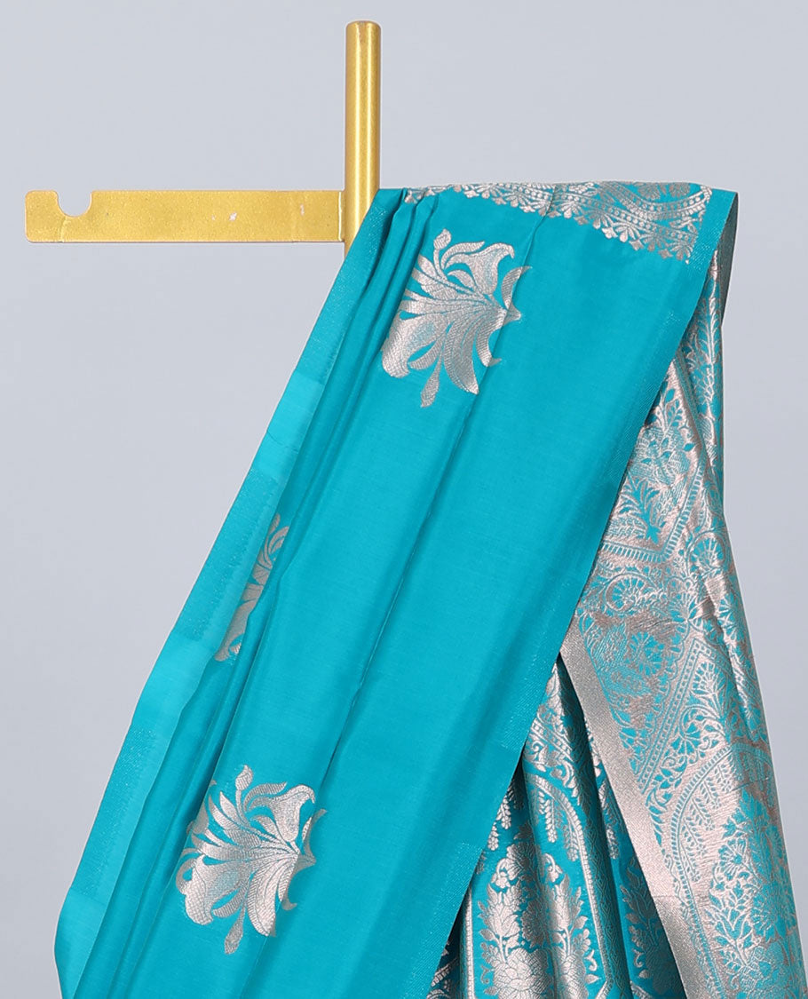 Borderless blue butter silk saree with zari buttas, contrast pallu of intricate designs in zari