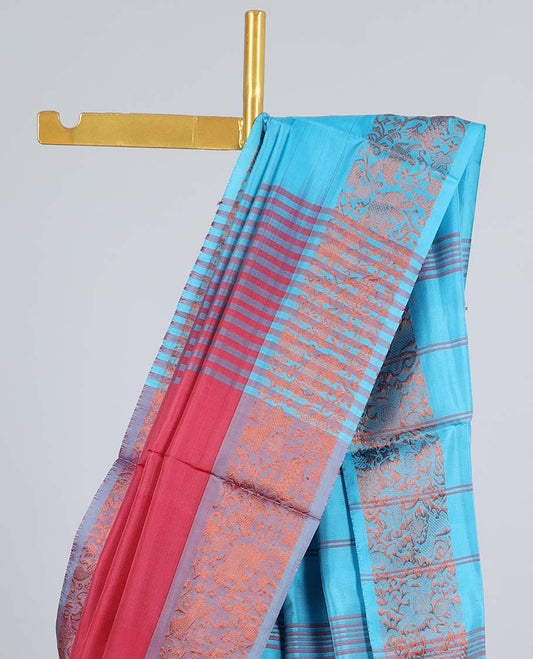 Maroon banana pith saree with buttas, contrast animal motifs border & pallu of stripes