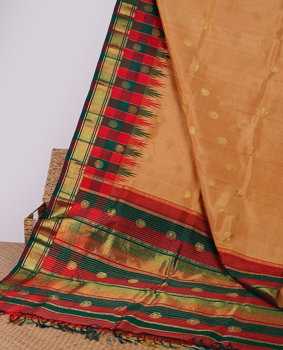 Orange buttas kancheepuram silksaree, contrast intricate zari pallu & checked temple border of thilakam mokku & banaras