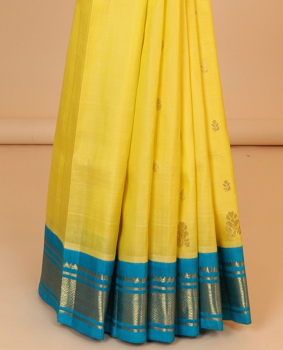 Yellow buttas kancheepuram silksaree, contrast zari design pallu & korvai border of thilakam mokku,banaras & jaal