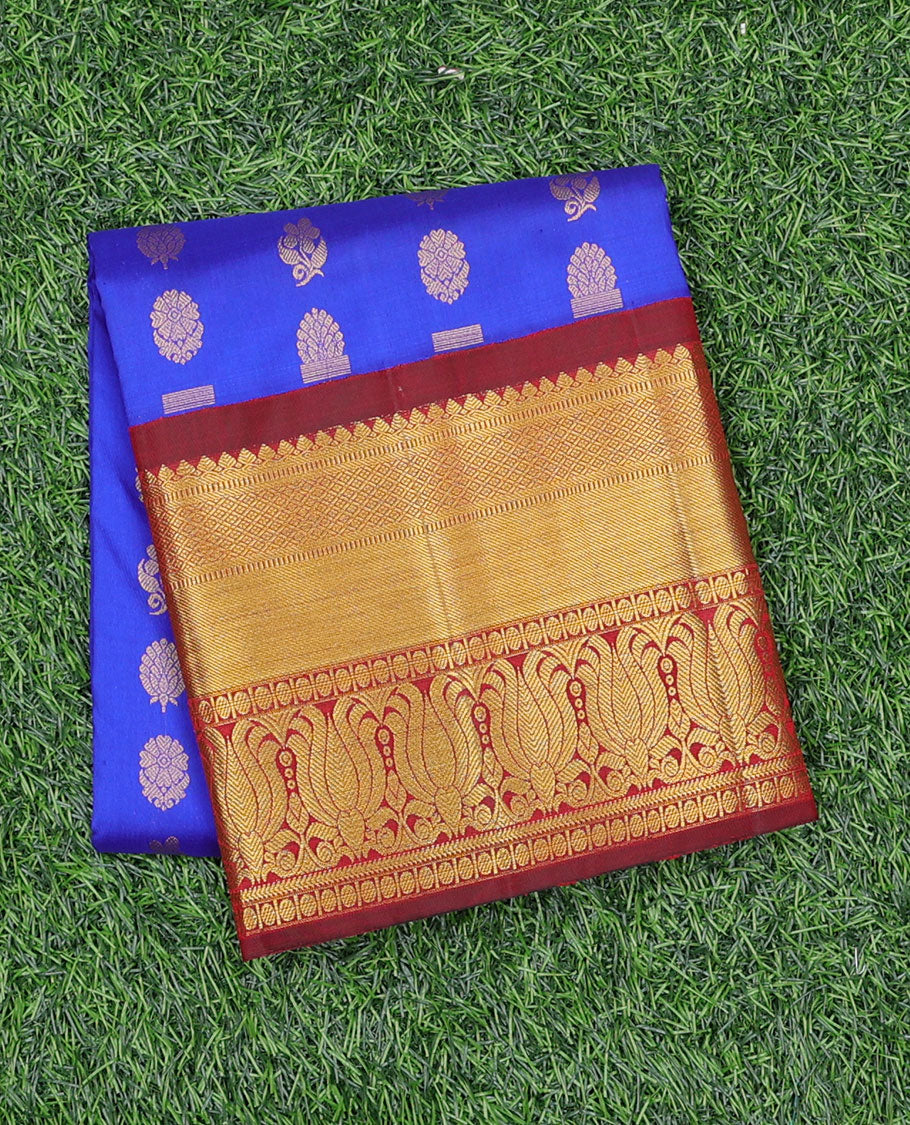 Blue zari buttas navarathna pavadai material, contrast blouse & traditional zari design border