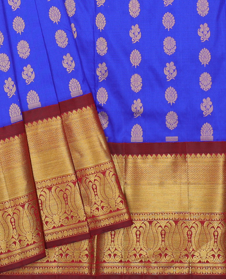 Blue zari buttas navarathna pavadai material, contrast blouse & traditional zari design border