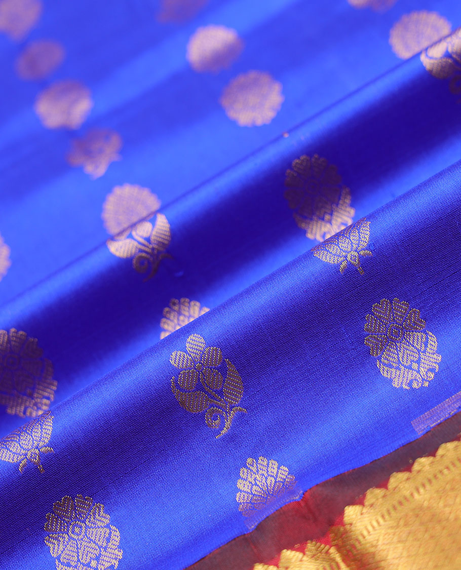 Blue zari buttas navarathna pavadai material, contrast blouse & traditional zari design border