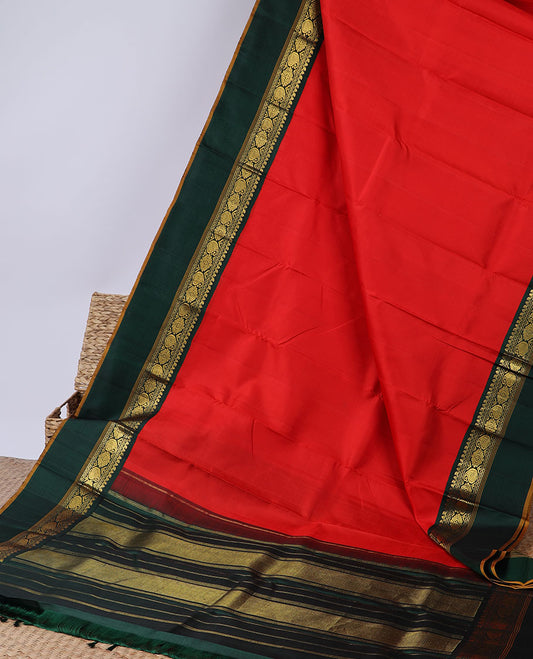 Orange plain kanchipuram silksaree, contrast zari design pallu & korvai border of salngai,neli,kamalam & manga