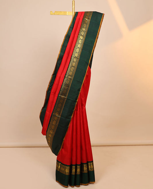 Orange plain kanchipuram silksaree, contrast zari design pallu & korvai border of salngai,neli,kamalam & manga