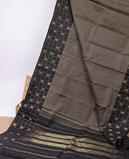 Black striped silk saree, zari checked border of mayil chakram & zari-rich pallu of seppu rekku